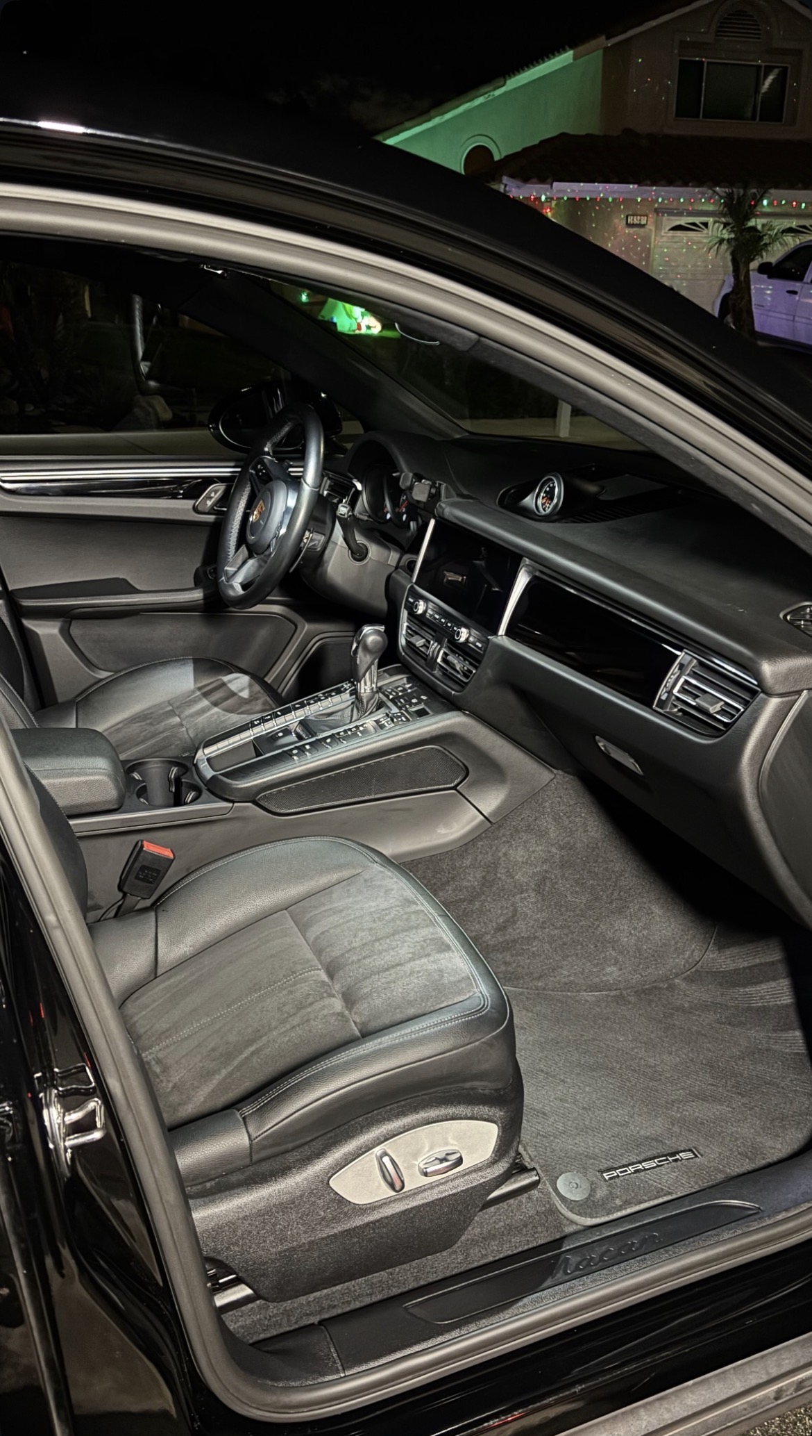 Porsche Macan interior after professional detailing — clean seats and fresh floor
